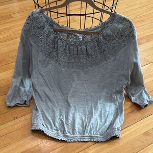 Woman’s off the shoulder lace top